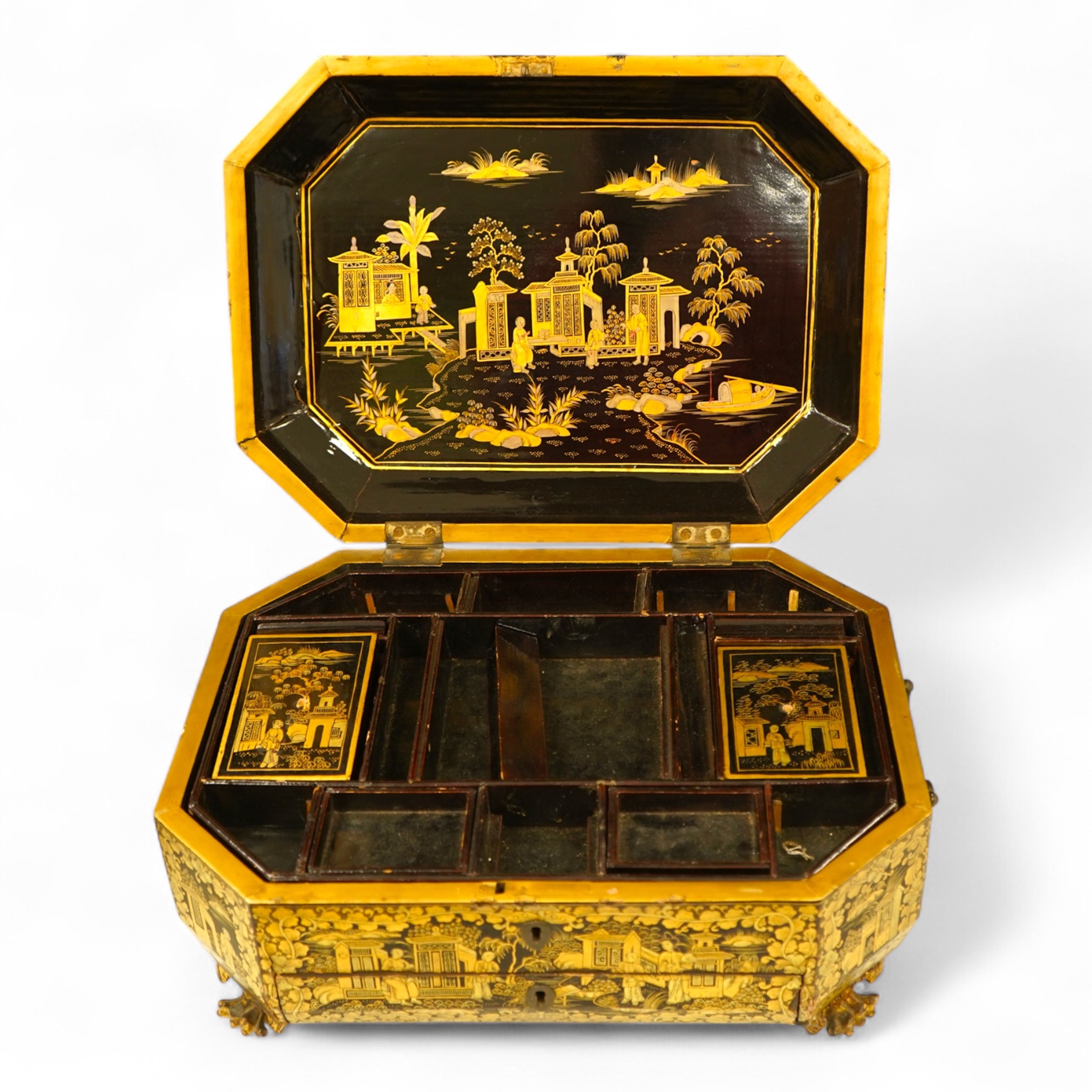 A Chinese export octagonal lacquered work box with fitted interior, 35cm wide
